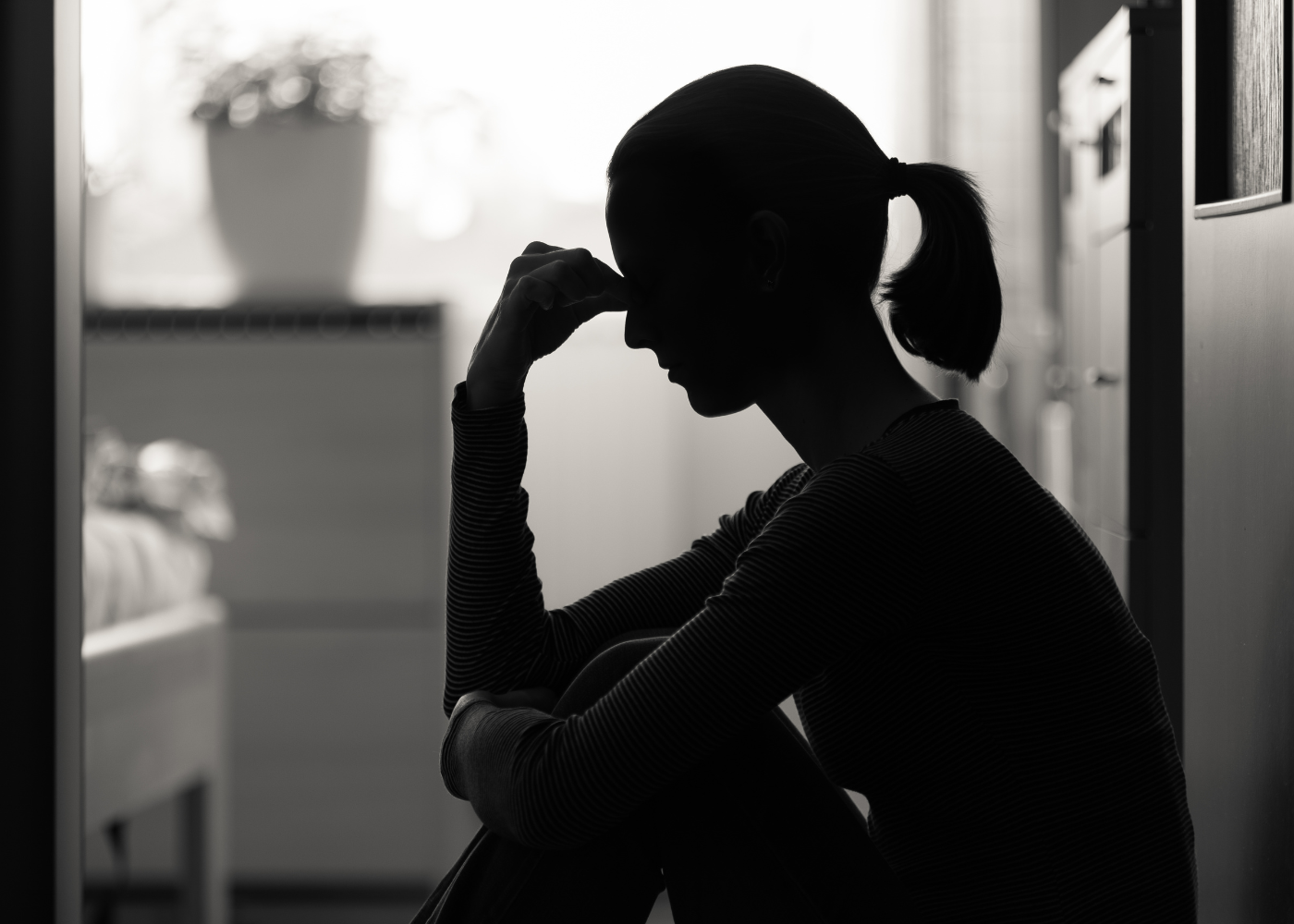 Silhouette of Anxious Woman Sitting